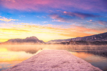 Amazing sunrise at the lake Bled in winter