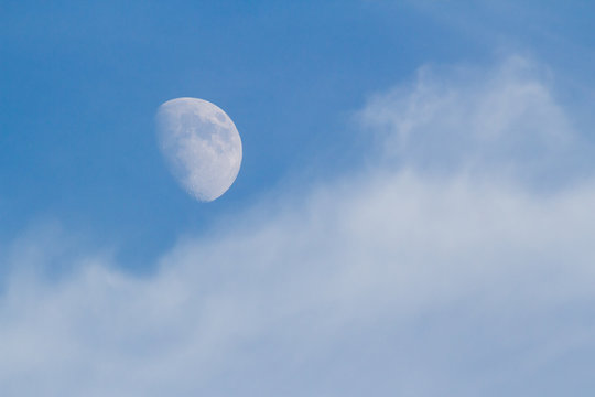 Moon, Clouds, and Blue Sky