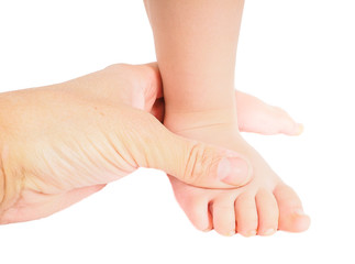Male hand holding firmly around a foot of toddler isolated on wh