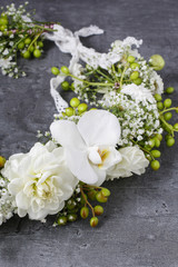 Flower wreath with carnations, orchids and gypsophila paniculata