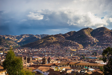 Fototapeta na wymiar Sunset over Cusco, Peru, with storm clouds