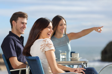 Group of friends looking at horizon in a restaurant