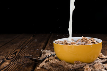 Pouring Milk on a portion of Cornflakes