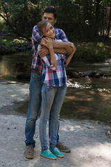 Obraz premium Romantic couple outdoors, hugging