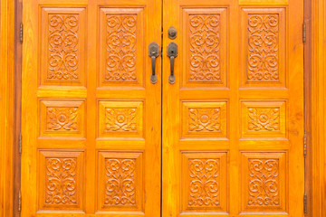 Wood Carving of door Thai background.