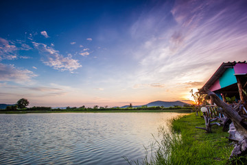 Fototapeta premium landscape with sunset over lake