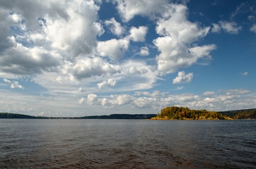 Landscape colorful autumn forest lake river sky clouds