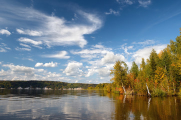 Landscape colorful autumn forest lake river sky clouds