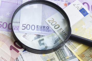 Magnifying Glass Over Euro Banknote