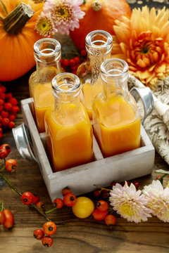 Bottles with orange juice
