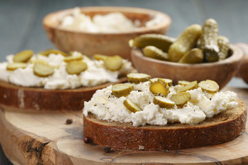 sandwiches with rye bread, cream cheese and marinated cucumbers