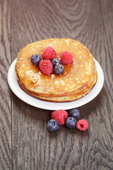 Pancakes with raspberry, blueberry and maple syrup