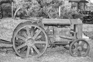 Plakat Old rusted antique tractor detail in black and white