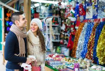Young man with girlfriend at  X-mas market