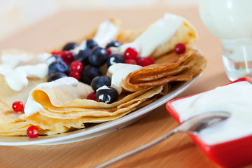 pancakes with berries and diary cream