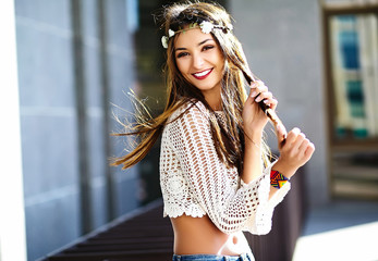 Funny stylish sexy smiling beautiful young hippy woman model in summer white fresh hipster clothes  in the street