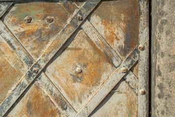 old sheet metal on background of a concrete wall texture