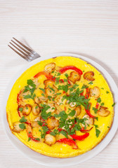 omelet with mushrooms, and vegetables