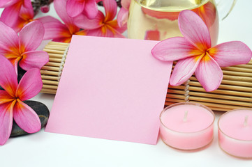 Tropical spa setting white pink paper note on white background