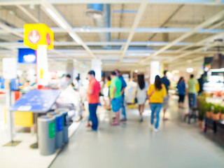 Blurred image of people shopping at mall of home decor