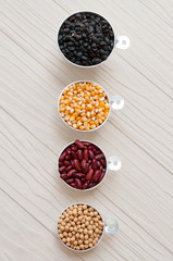 collection set of beans, legumes, peas, lentils on white wooden
