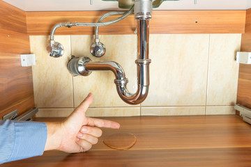 flood  under drain of sink in bathroom