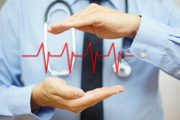 cardiologist is protecting with hand heart bit line