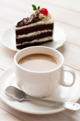 A cup of cafe latte and cake