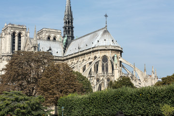 Fototapeta na wymiar The spire and east side of Cathedral Notre Dame de Paris