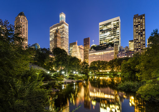 Central Park Pond and illuminated Manhattan Skyscrapers, New York City