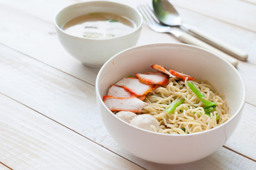 Noodles Soup with Fish Balls on wood table