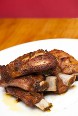 Roasted pork ribs on a white plate