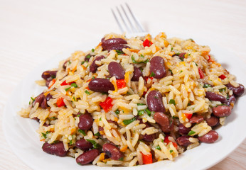 Rice with red beans and vegetables on plate