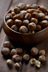 Close-up of a wooden bowl with cobnuts, selective focus