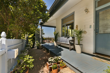 Backyard cozy patio area with wicker furniture set