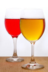 Glass of red and white wine on a white background