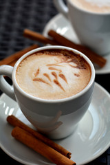 White Cup Of Foamy Cappuccino On A Black Background