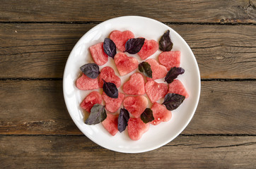 Watermelon salad with feta cheese and basil tomatoes with balsamic dressing    