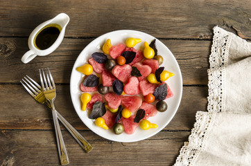 Watermelon salad with feta cheese and basil tomatoes with balsamic dressing    