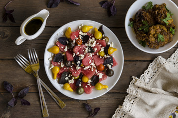 Watermelon salad with feta cheese and basil tomatoes with balsamic dressing    