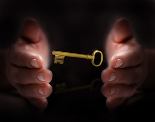 
Hand protect golden key
