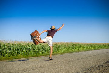 Image of male with suitcase rushing forward and waving hand on