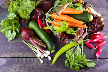 Heap of fresh vegetables on table close up