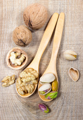 Closeup of a walnut and pistachios.