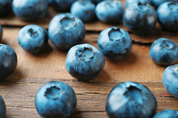 Fresh blueberries on wooden table, closeup