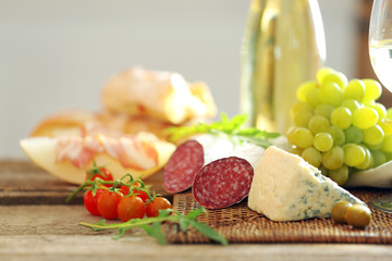 Still life with various types of Italian food and wine