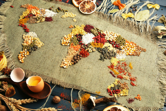 Spices on sackcloth on wooden background