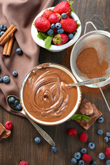 Beautiful composition with chocolate cream and ripe berries