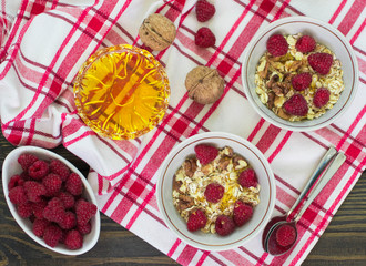 Homemade granola with raspberries, walnuts and honey