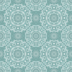 Vintage seamless pattern with elegant ornaments on blue background